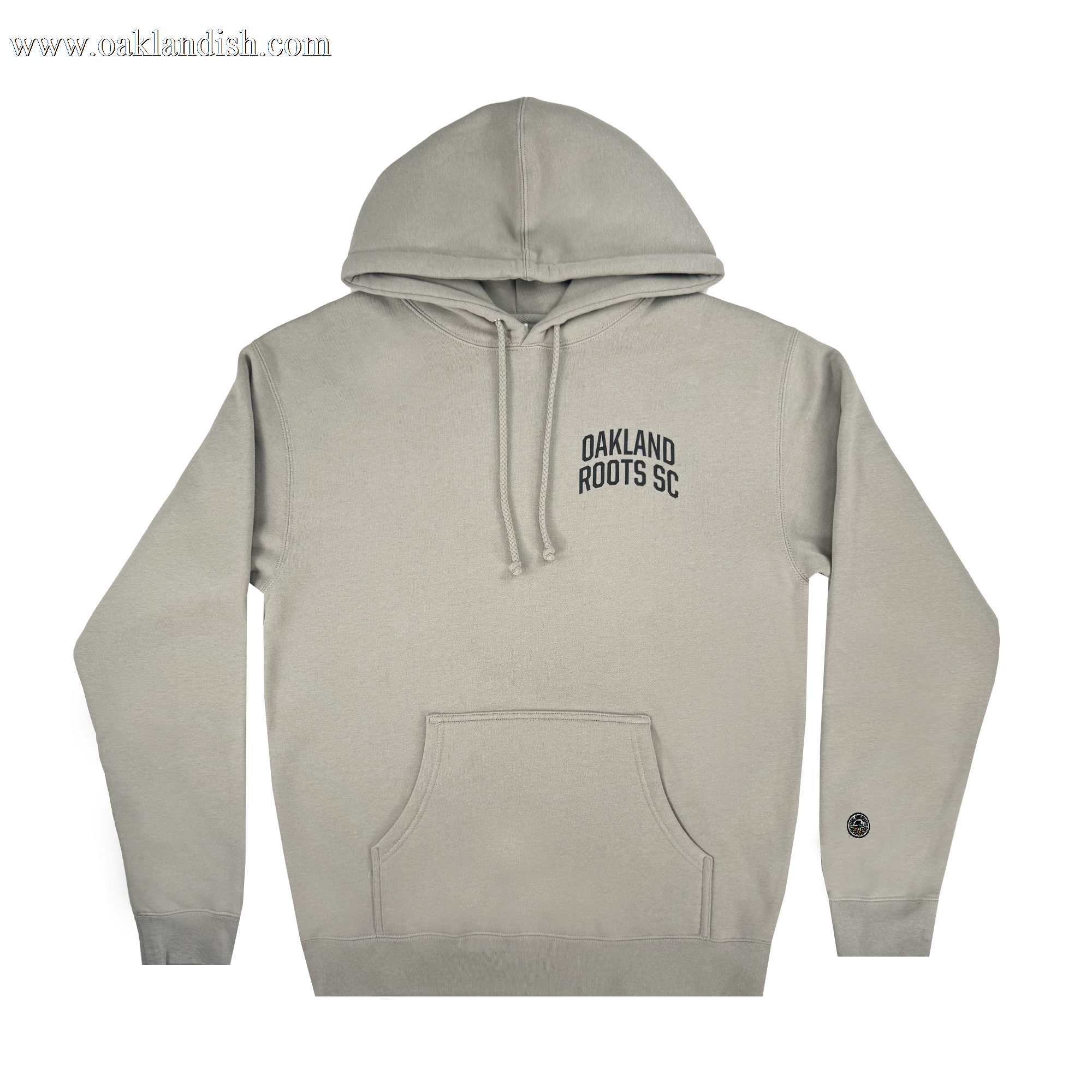 The Oakland Roots SC Classic Hoodie by Oakland Roots SC showcases a light gray design with a front pocket and drawstring hood, "Oakland Roots SC" on the left chest, and a small circular black patch on the lower right sleeve, combining Soul style with comfort.