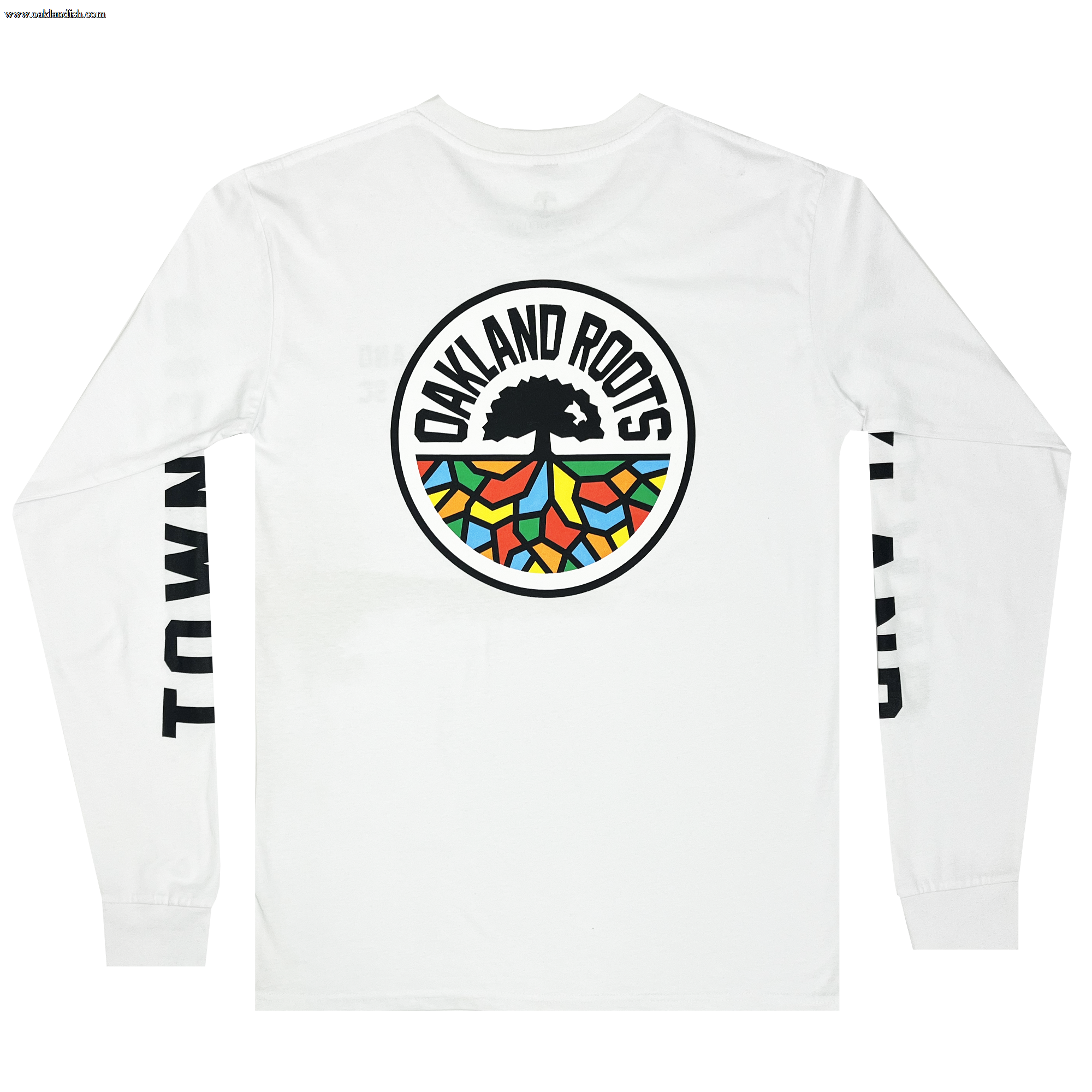 The Oakland Roots SC Classic 2.0 LS Tee, a white long-sleeve t-shirt from the Oakland Roots SC brand, features the sports club's logo—a tree with colorful roots—prominently on the back and has "TOWN" printed in large black letters down both sleeves.