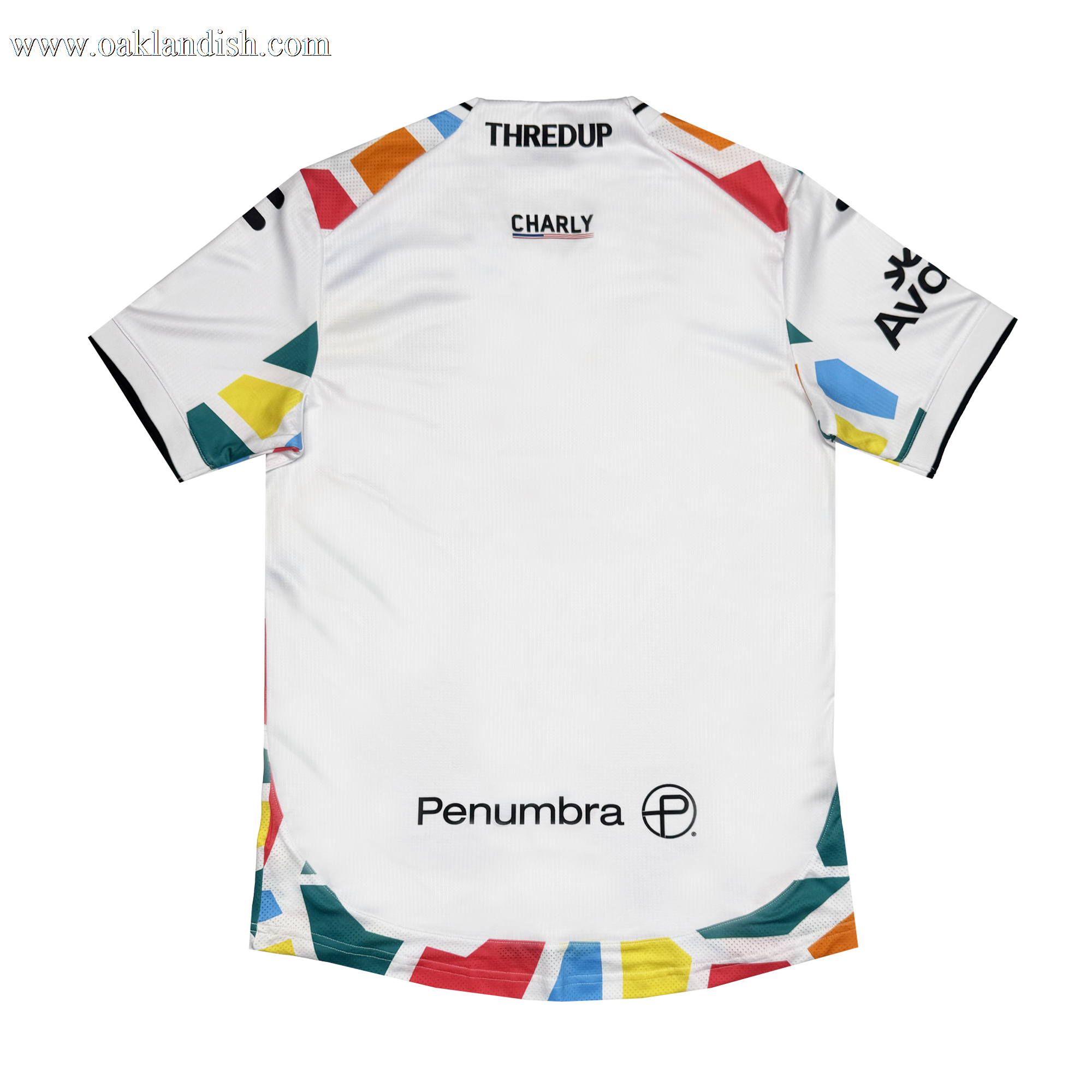 The Unisex Mosaic in Motion Kit by Oakland Roots SC features vibrant geometric mosaic patterns on the back, with black “THREDUP,” “CHARLY,” “AVO,” and “Penumbra” logos decorating the upper and lower sections.