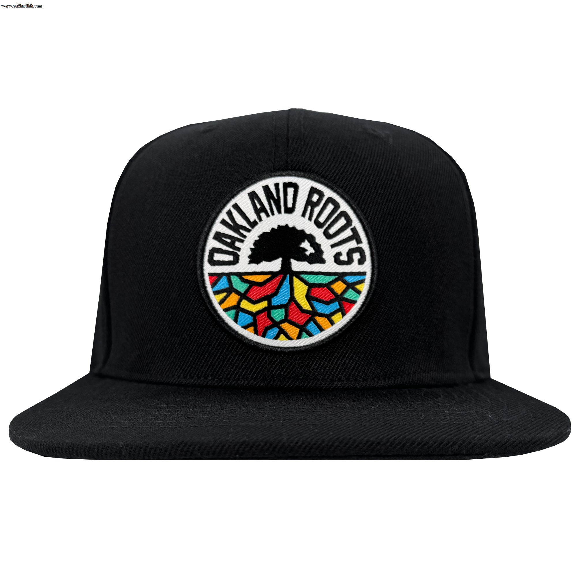 The Oakland Roots SC Structured Snapback by Oakland Roots SC is a black flat-brim hat with a circular patch displaying “OAKLAND ROOTS,” a tree silhouette, and colorful root-inspired patterns—ideal for any Oakland sports fan.
