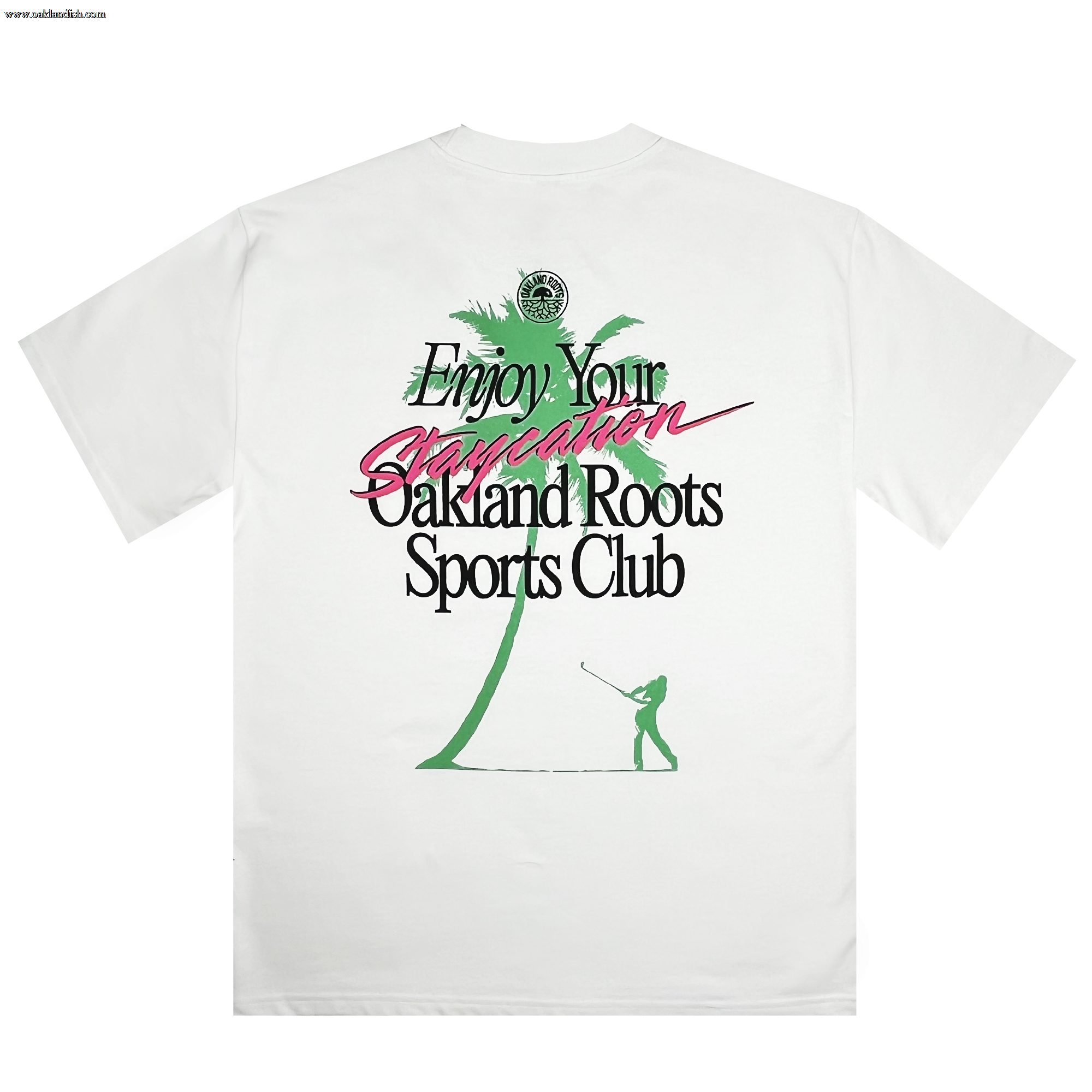 The Staycation Heavy Tee by Oakland Roots SC features a boxy fit and showcases a green palm tree alongside a silhouette of a person golfing. The design includes the text "Enjoy Your Staycation" in teal and pink colors, with "Oakland Roots Sports Club" written below in black. As part of the Oaklandish collection, this shirt also supports social good initiatives.