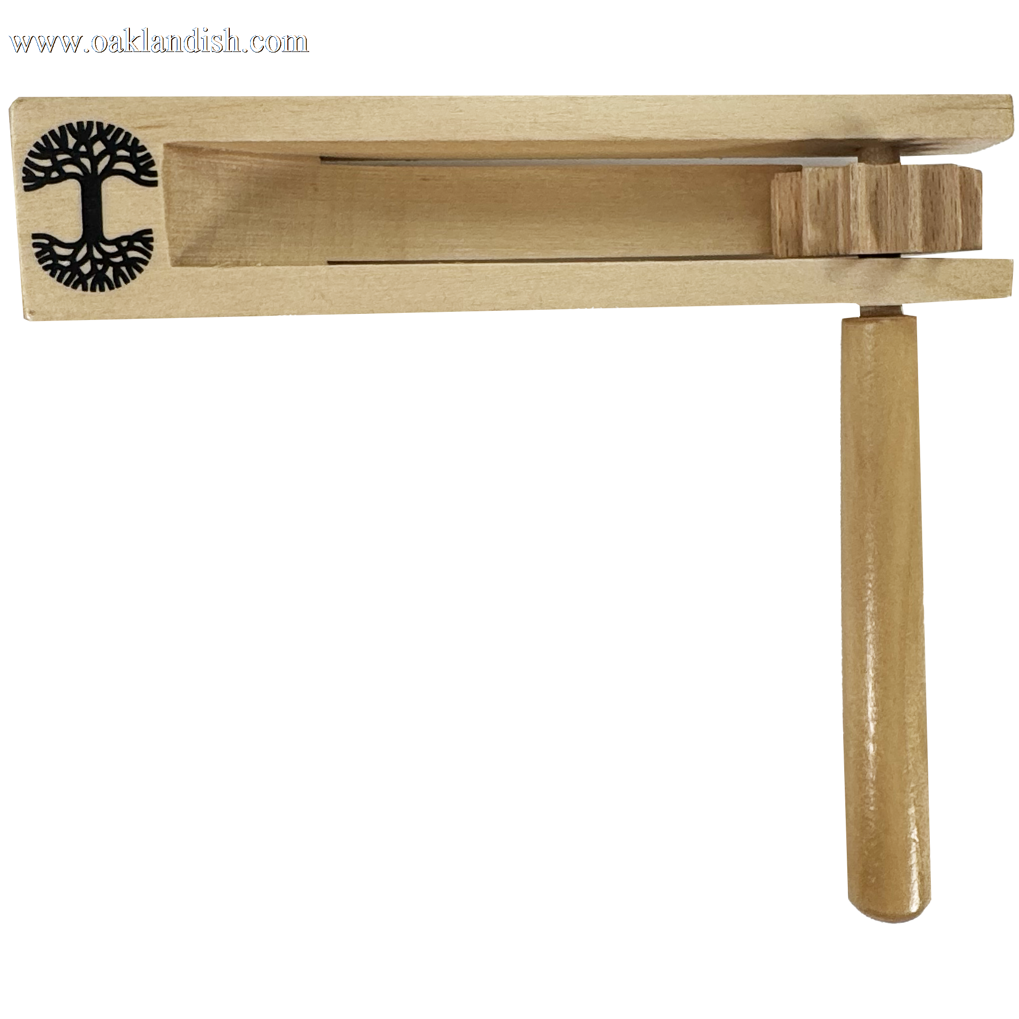 The Oakland Roots SC Matraca by Oakland Roots SC is a wooden noisemaker with a handle and rectangular body. It features a carved tree design and produces sound when spun. Crafted from light-colored wood, it's perfect for any fan's spirited enthusiasm at an Oakland Roots sports club game.