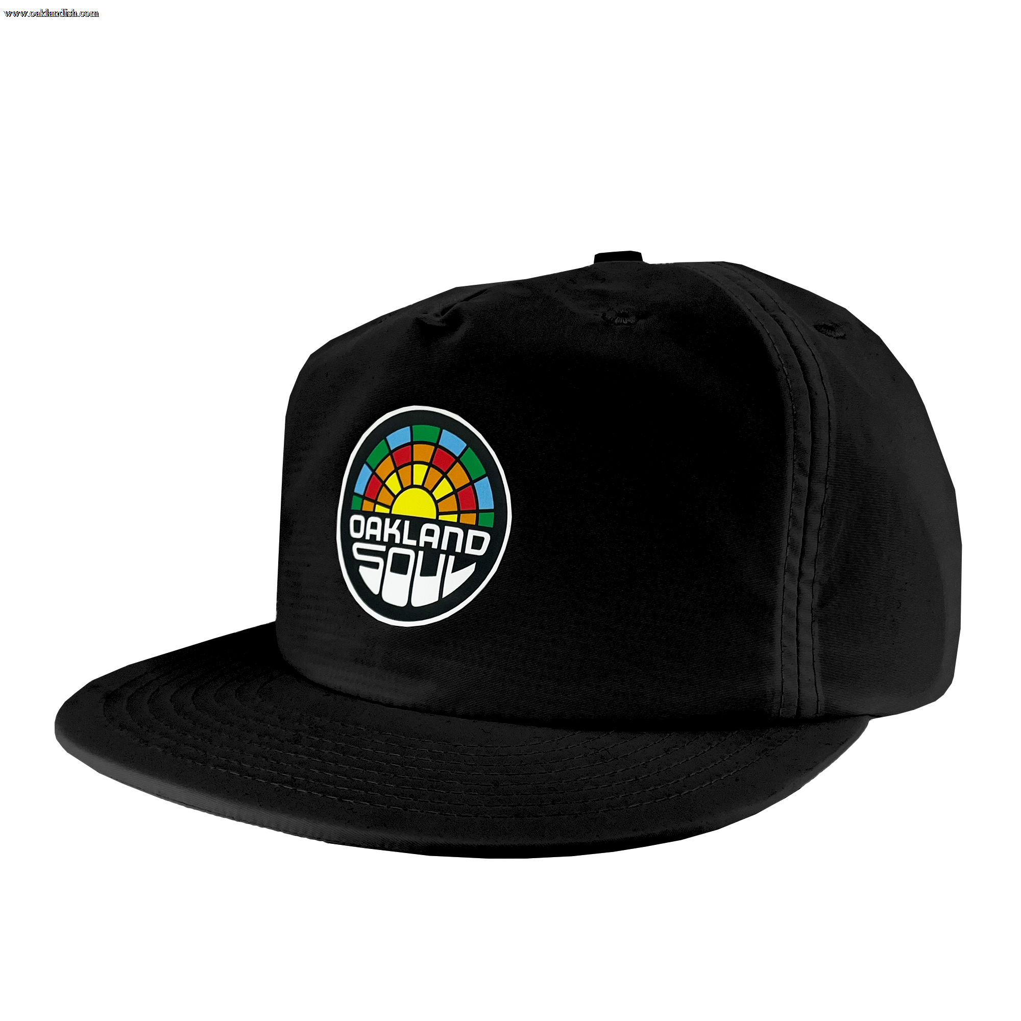 The Oakland Soul Surf Cap is a black snapback hat boasting a vibrant geometric design reminiscent of a sunrise or sunset on the front panel. Below this design, the text "OAKLAND SOUL" is prominently displayed in honor of the women's soccer team from the USL W-League. The hat features a slightly curved bill and noticeable stitching details.