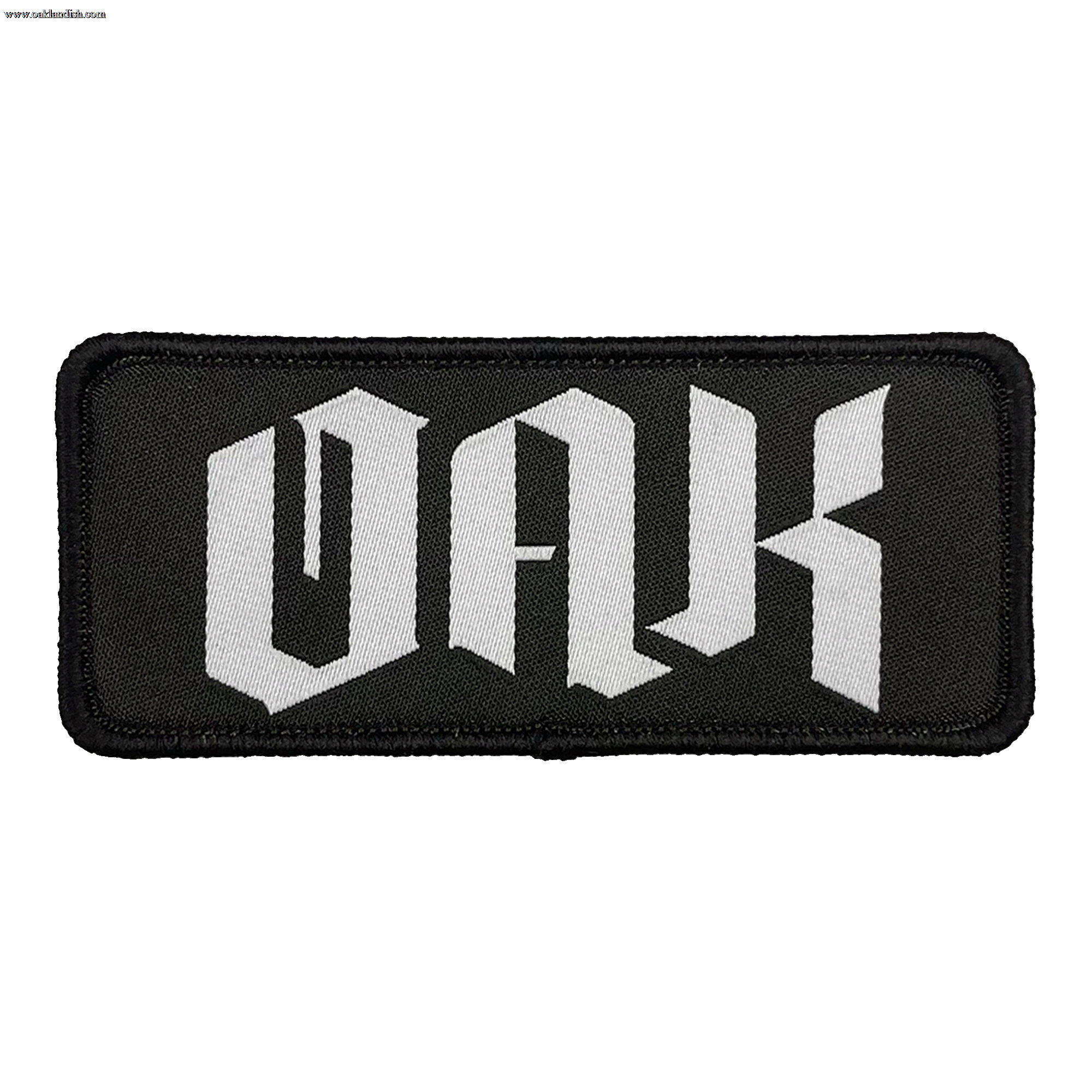 The OAK Official Patch by Oaklandish is a rectangular black emblem with a matching border and prominently displays the letters "OAK" in bold, white Gothic script. The intricate lettering evokes a medieval aesthetic, adding an element of classic elegance to your accessories. This embroidered iron-on patch offers a stylish touch to your collection.