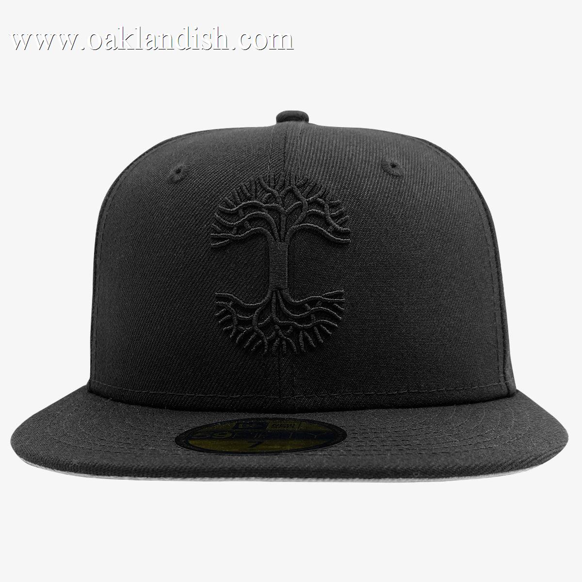 The New Era X Oaklandish Classic 59FIFTY Fitted Cap features a black flat brim, an embroidered Oaklandish logo on the front, and a structured crown for a modern shape. The cap also includes a visible sticker on the brim. Photographed against a plain white background, this cap remains the focal point of the image.