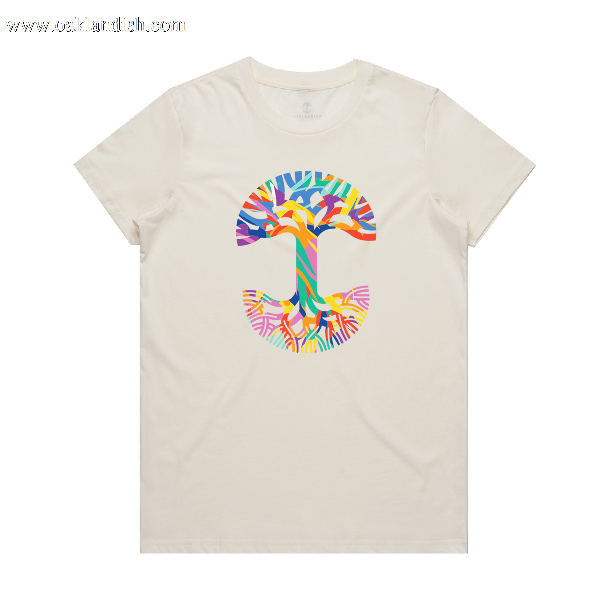 The Women's Urban Tropics Tee by Oaklandish is a cream-colored shirt with a bold abstract "T" on the chest, showcasing Kalani Ware’s vibrant multicultural design in blue, orange, yellow, green, pink, and purple hues.