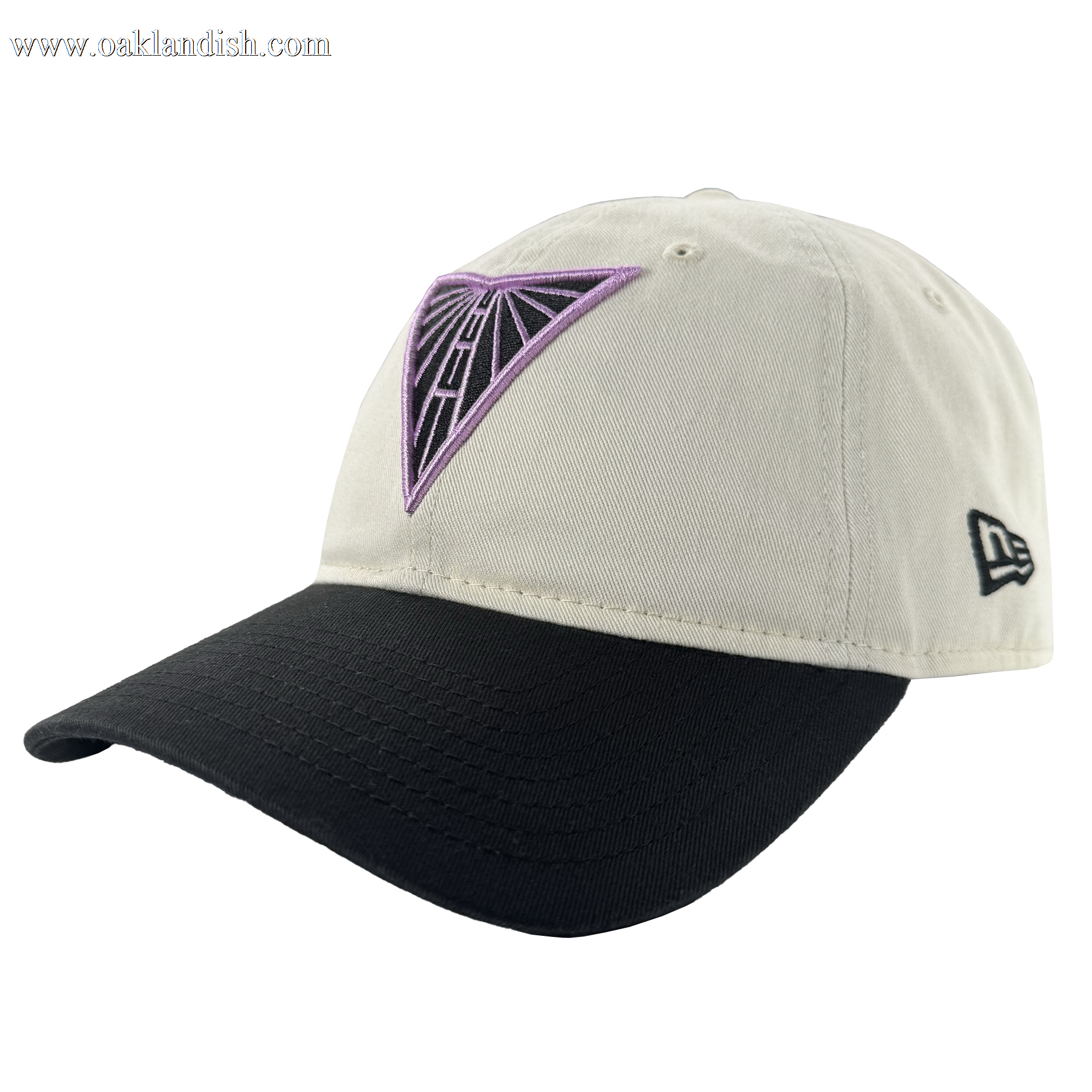 The GSV Logo 2 9TWENTY Hat by GSV features a beige crown, black curved brim, adjustable strap back, and a purple and black geometric triangle inspired by the Golden State Valkyries. A small black New Era logo accents the left side.