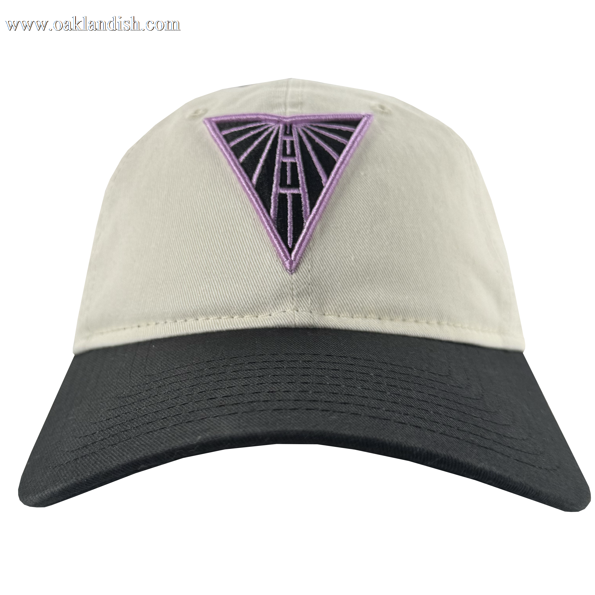 The GSV Logo 2 9TWENTY Hat by GSV is a beige dad cap with a black brim, featuring a purple and black embroidered triangle road design on the front. It has an adjustable strap back for comfort. Photographed on a plain white background.