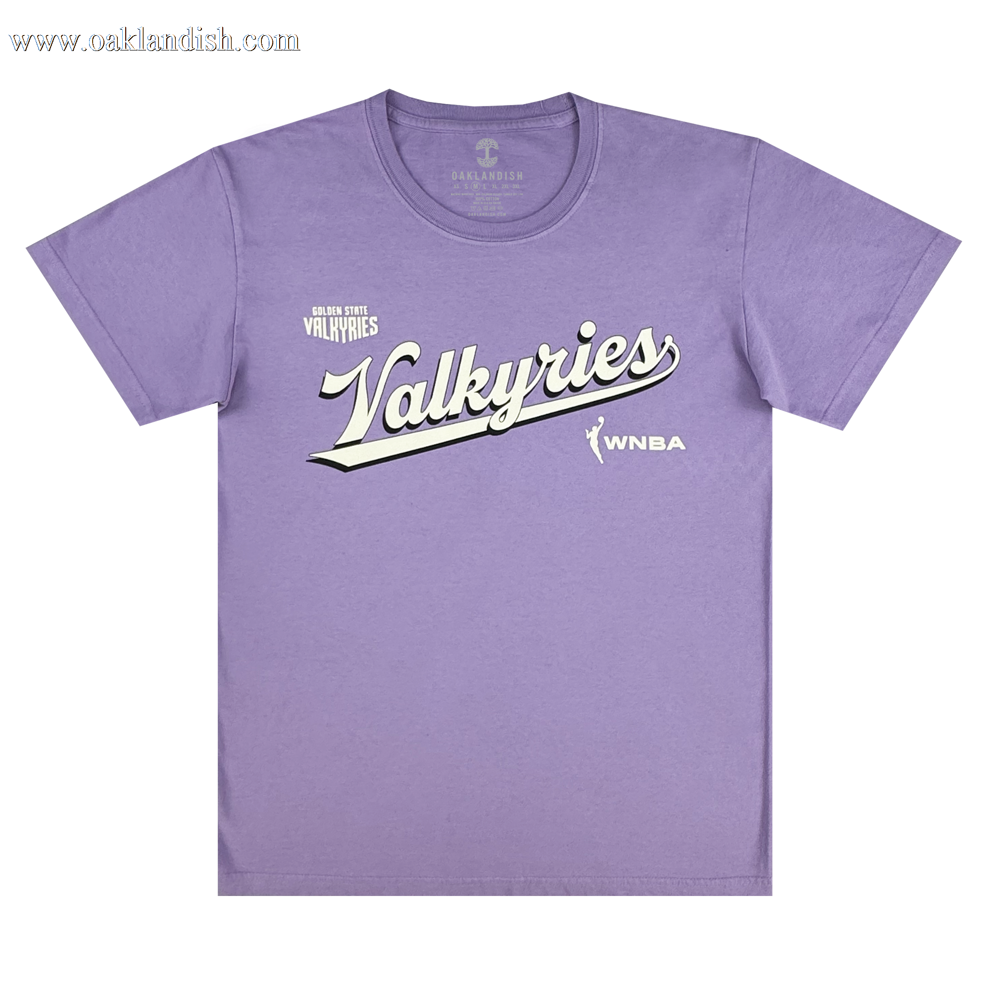 The GSV Golden State Valkyries Retro Script Premium Tee is a light purple, organic cotton heavy tee with "Valkyries" in large white script, "Golden State Valkyries" above, and the WNBA logo and text on the lower right.
