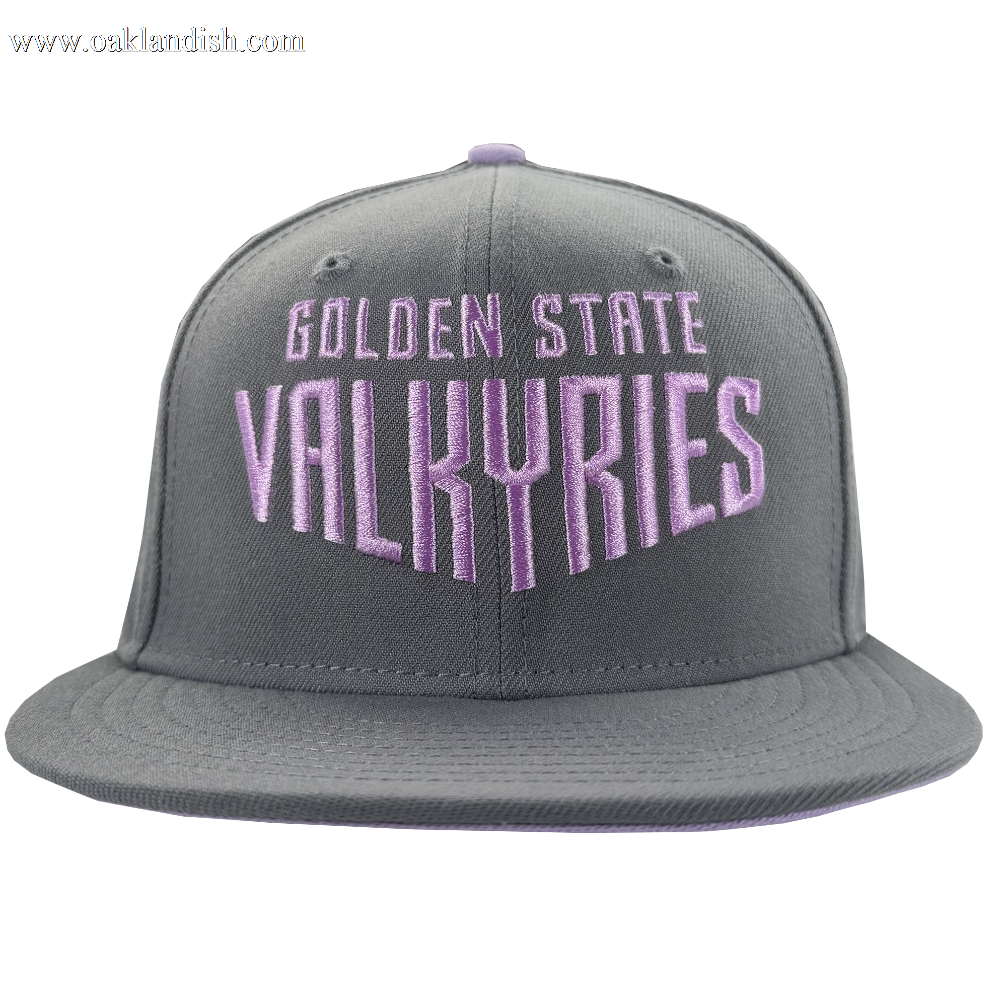 The GSV Wordmark 9FIFTY Snapback by GSV is a gray cap with "Golden State Valkyries" boldly embroidered in lavender and white on the front, flat brim, and stitched panels, shown on a plain white background.