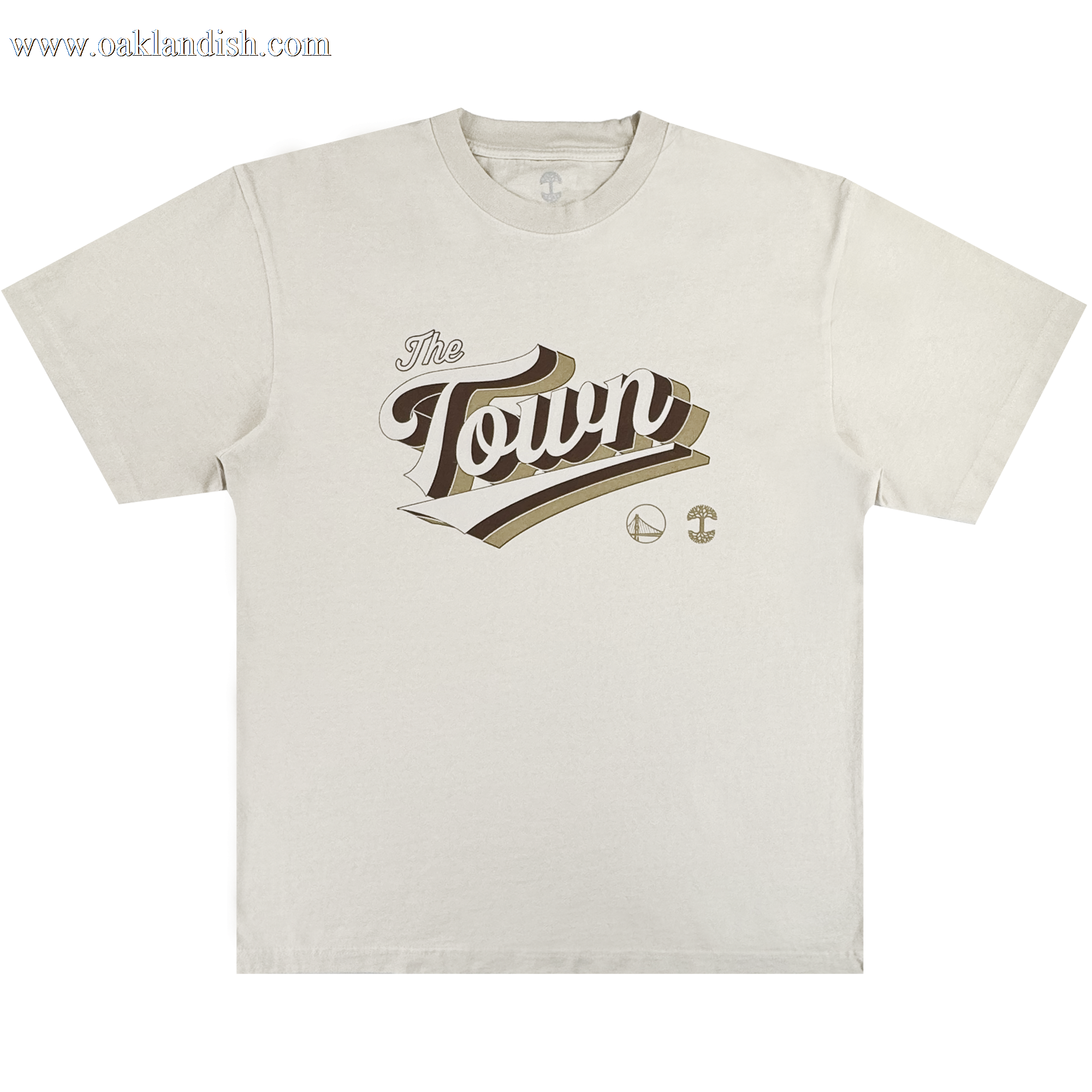 The Vintage Swash Tee by Other, from the Warriors x Oaklandish Town Collection, is a beige t-shirt showcasing "The Town" in bold brown script across the chest. Small icons of a basketball and bridge sit below the text, paying tribute to classic Warriors jersey designs. The shirt is displayed flat on a white background.