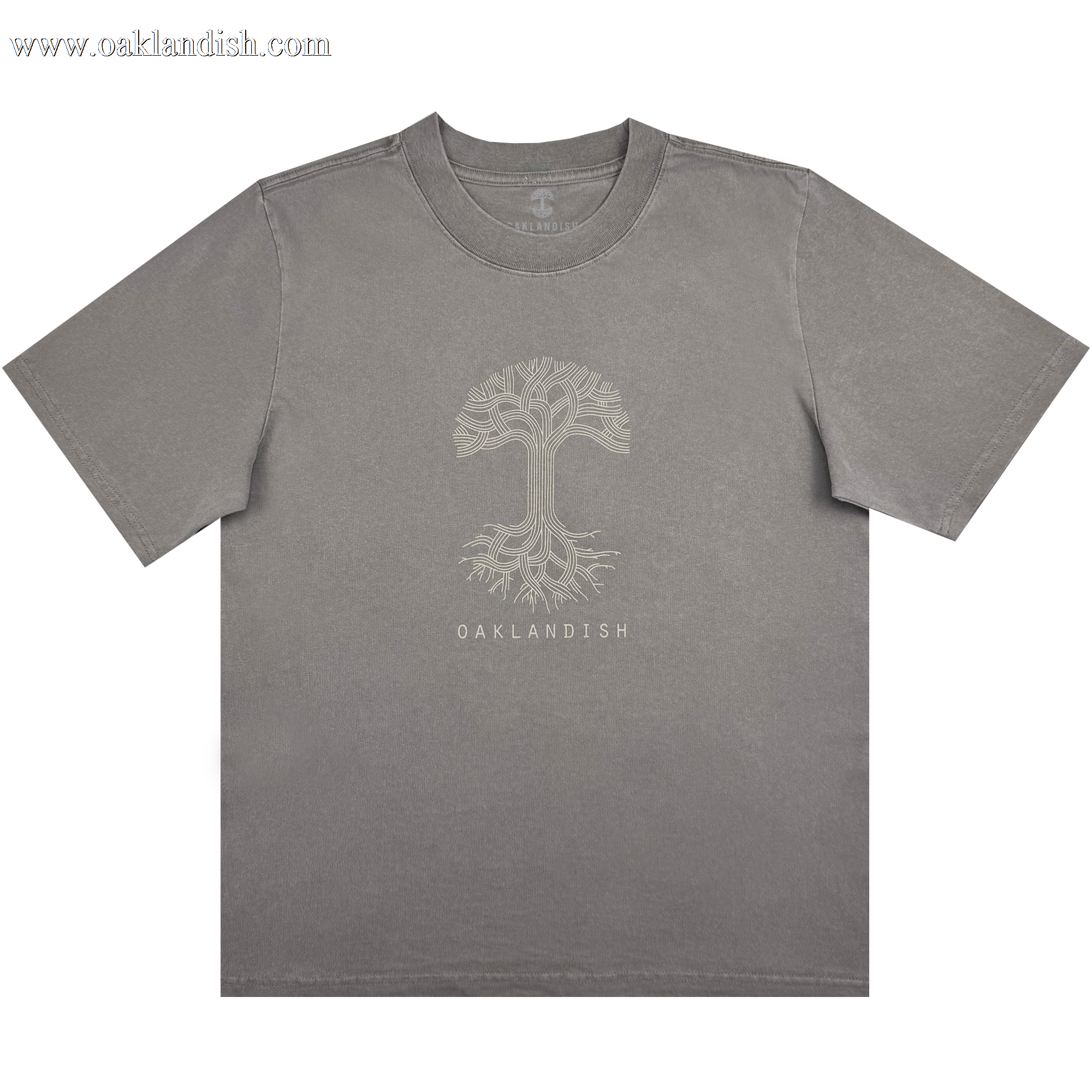 The Women's Oaklandish Classic Logo Heavy Tee by Oaklandish features an oversized fit in faded grey, showcasing a striking light beige tree design with intricate branches and roots. Crafted from heavy-weight 100% cotton, it includes "OAKLANDISH" text beneath the tree, a crew neck, and short sleeves for comfort.